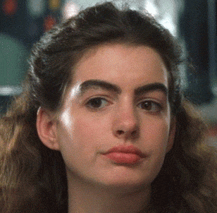 anne-hathaway-mirror-flirting-playing-with-eyebrows.gif