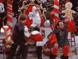 Kid jumping on Santa (Seinfeld Kosmo Kramer working as Santa Claus)