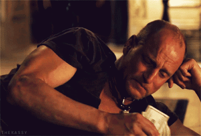 Woody Harrelson crying and wiping his tears with money