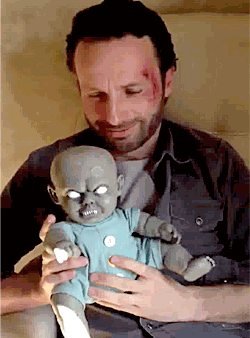 Rick Grimes playing with a zombie baby (The Walking Dead gifs)