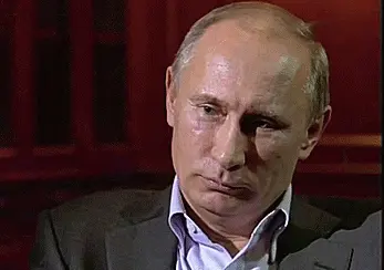 Vladimir Putin laughing