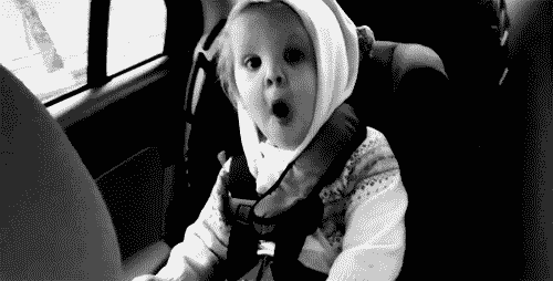 Excited Baby dancing on the back of a car
