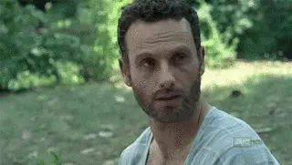 Rick Grimes (Andrew Lincoln) getting smashed on the face with a shovel